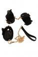 Set bondage con collare, guinzaglio e polsini.