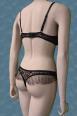 Body in microrete ricamata con volants. Beige-nero