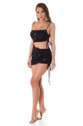 Mini abito nero con glitter ed ampio ritaglio in vita.