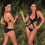 Monokini nero con incrocio e fibbie.